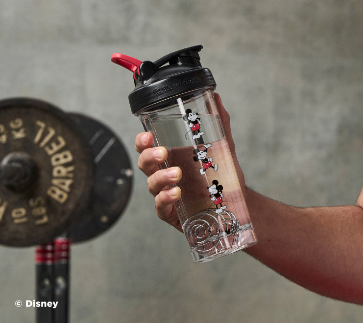 pro-series-b0 Mickey_Mouse_Protein_Shaker_Bottle_Being_Held_In_the_Gym.jpg